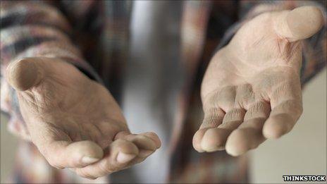 A man's hands reaching out