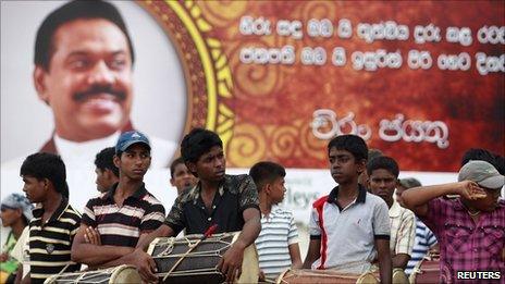 Boys with drums wait to take part in a dress rehearsal for President Mahinda Rajapaksa's second term swearing in ceremony at the presidential secretariat building in Colombo 17 November, 2010.