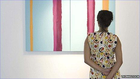 Woman looking at a painting