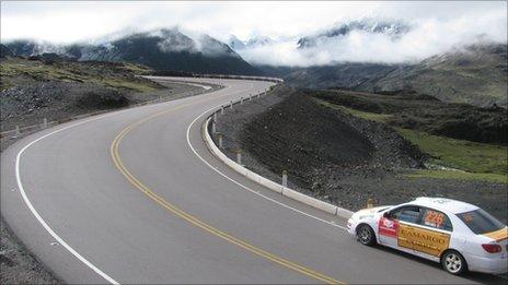 Car driving along the road between Cusco and Puerto Maldonado