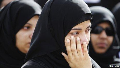 A relative of a protester, who was killed in Thursday's crackdown, mourns during a funeral procession in Sitra, east of Manama, 18 February 2011