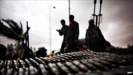 Libyan rebel fighters amass ammunition near the town of Ras Lanuf, 8 March 2011