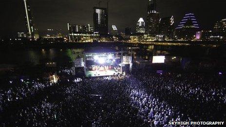 Hoards of SXSW attendees at an outside concert