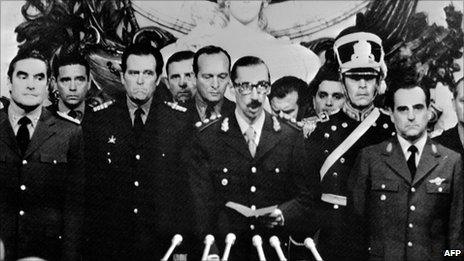 General Jorge Rafael Videla (C) before he was sworn in as Argentina's President, on 30 March after a military coup 24 March 1976