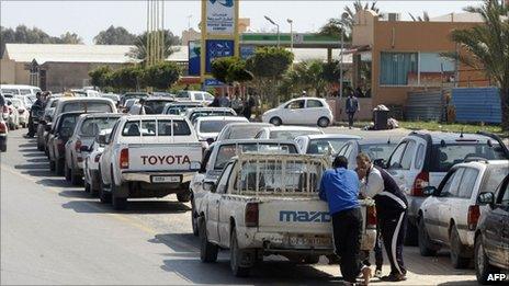 People queue outside a petrol station in Tripoli. Photo: 25 March 2011