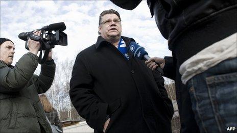 Timo Soini speaks to reporters after voting in Espoo, Helsinki, 17 April