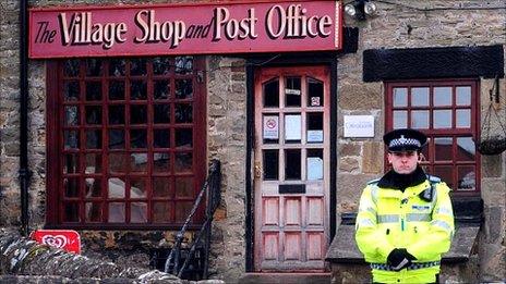 Police officer outside Melsonby post office after murder of Diane Garbutt