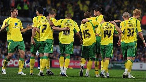 Norwich celebrate after Gareth McAuley's own goal