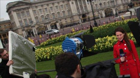 TV presenter outside Buckingham Palace