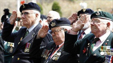 British veterans salute during the Gloster Valley memorial service