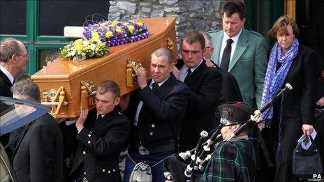 David and Katie Taylor follow the coffin of their daughter Sophie from the Lecht Ski centre where her funeral was held.