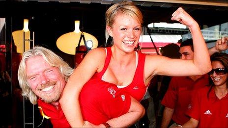 Sir Richard Branson and woman at the launch of a Virgin Active gym in Australia