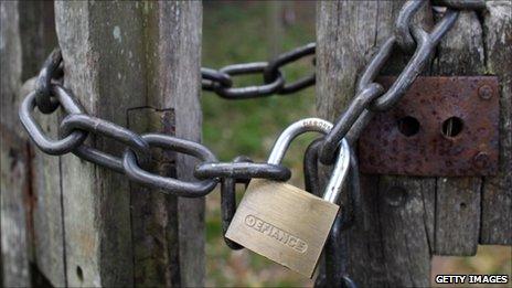 A padlock on a gate