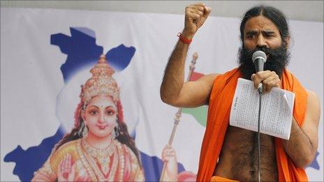 Indian yoga guru Ramdev speaks as he shows support to the hunger strike by 73-year-old Indian activist Anna Hazare in New Delhi, India, Friday, April 8, 2011