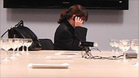 Woman in boardroom (picture posed by model)