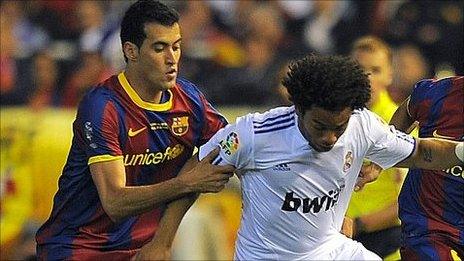 Sergio Busquets (l) and Marcelo (r)