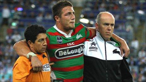 Sam Burgess is helped from the field after injuring his ankle