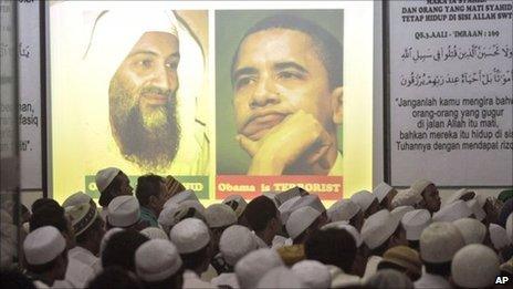 Pictures of Osama Bin Laden (L) and Barack Obama (R) projected at a meeting of an Islamist group in Jakarta, Indonesia - 4 May 2011