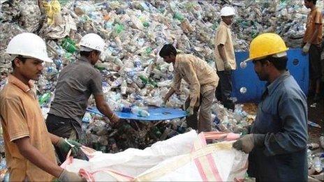 Workers at an Indian polyester recycling plant