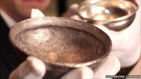 Archaeologist Frank Hargrave and silversmith Alex Brogden examine a 2,000 -year-old Iron-Age silver bowl.