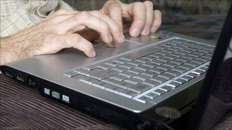 man on computer