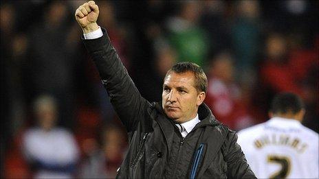 Swansea boss Brendan Rodgers punches the air after their battling draw at Forest