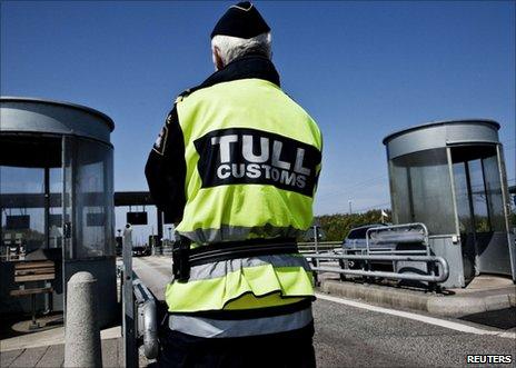 A Swedish customs officer stands at the Oeresund Bridge with Denmark, 6 May 2011