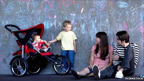 Family with baby in a buggy