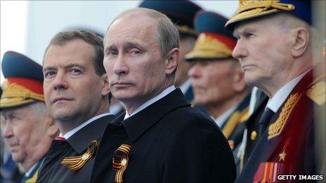 Dmitry Medvedev (left) and Vladimir Putin (centre) at Moscow's Victory Day parade (9 May 2011)