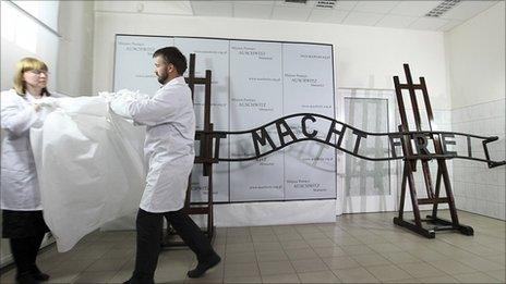 Restored Auschwitz sign unveiled by technicians