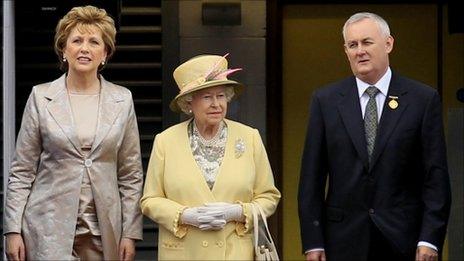 Queen Elizabeth II, Irish President Mary Mc Aleese, and Christy Cooney, president of the Gaelic Athletic Association. look out at the pitch at the home of the GAA, Croke Park Stadium, in Dublin.