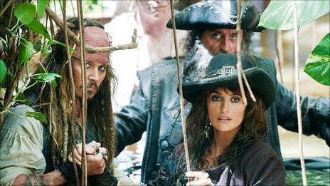 Johnny Depp with Ian McShane (behind) and Penelope Cruz in Pirates of the Caribbean: On Stranger Tides