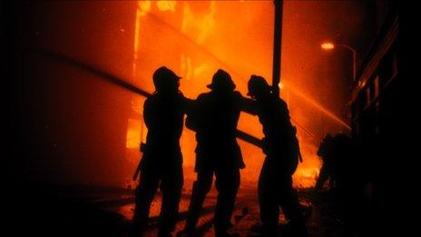 Firefighters trying to put out a fire during the Brixton riots