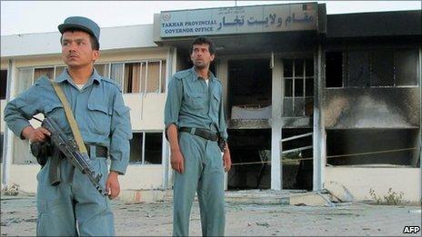 Afghan policemen outside Takhar provincial governor's office where Gen Daud was killed on 28 May 2011