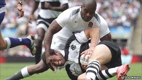 Ugo Monye challenges Barbarians full-back Nicolas Jeanjean for the ball before scoring England's second try