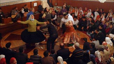 Alevi faithful dance at a religious service in Turkey