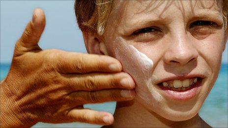 Boy with sun cream