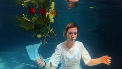 Helen Morton of the Three Bugs Fringe Theatre company performs Ophelia drowning in the Apex Hotel swimming pool