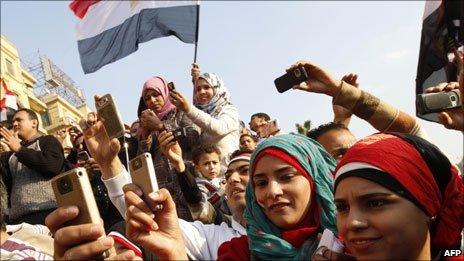 Egyptians use their mobile phone to record celebrations in Cairo's Tahrir Square in February after Hosni Mubarak resigned