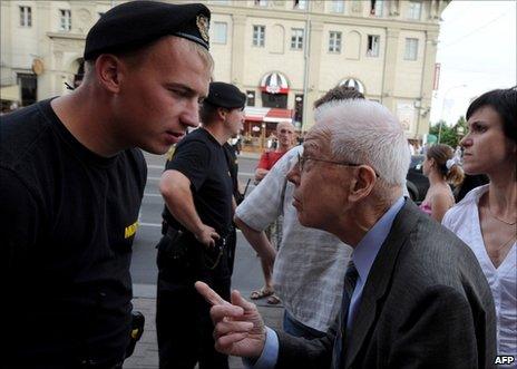 A Belarusian policeman argues with a man trying to reach the protest area in Minsk, 15 June