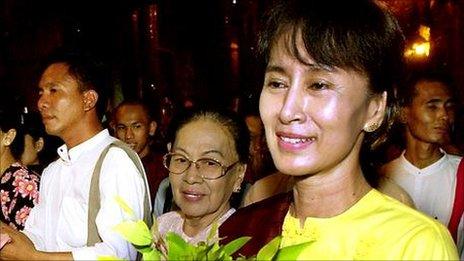 Aung San Suu Kyi walks with friends and family in Yangon