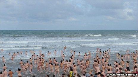 Mass skinny dip at Rhossili on Gower