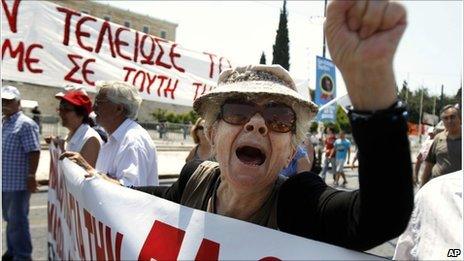 A protester of the Greek Communist party shouts slogans during a rally in Athens on 18 June