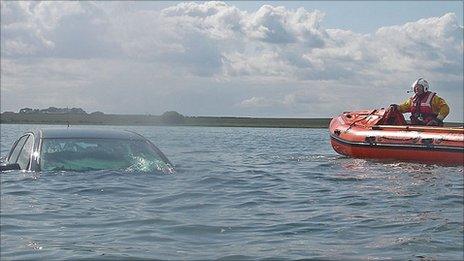 Car under water on Holy Island causeway