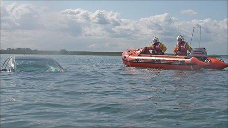 Car under water on Holy Island causeway