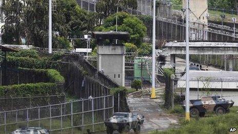 Three armoured vehciles are parked near the main entrance of El Rodeo II prison in Guatire, Venezuela, 19 June 2011.