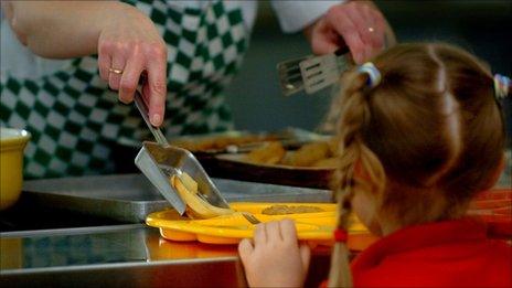 Pupil receives school dinner