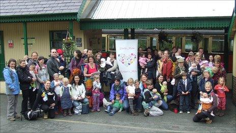 Breastfeeding mothers and their supporters prepare to board the Snowdon train