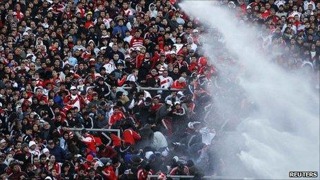 Police used water cannon to disperse River Plate fans at the end of the match against Belgrano in Buenos Aires (26 June 2011)