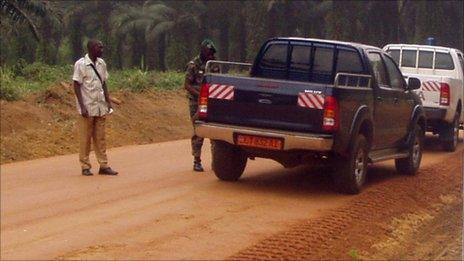 Cars on a dust road in Cameroon (archive shot)